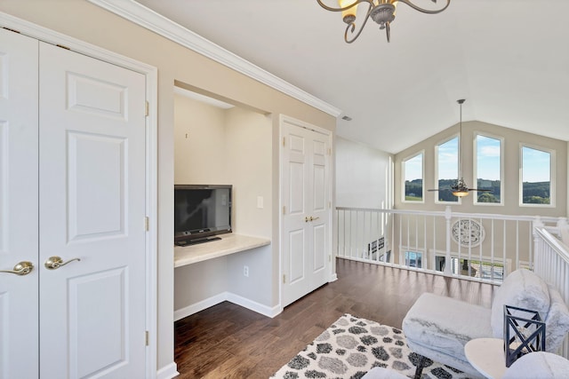 sitting room with an inviting chandelier, dark hardwood / wood-style floors, vaulted ceiling, and ornamental molding