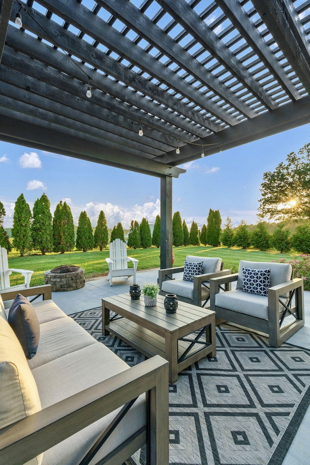 view of patio featuring a pergola and an outdoor living space with a fire pit