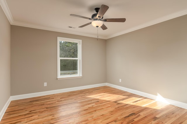 empty room with ceiling fan, light hardwood / wood-style floors, and ornamental molding