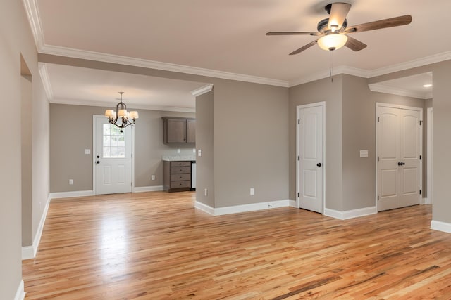 unfurnished living room with ceiling fan with notable chandelier, light hardwood / wood-style flooring, and ornamental molding