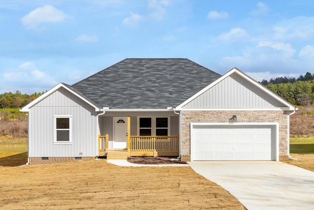 view of front of house featuring covered porch and a garage