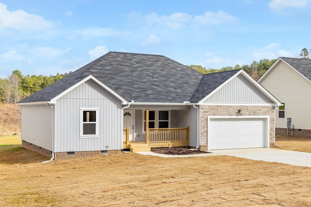 view of front of property featuring covered porch and a garage