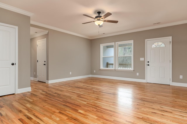 foyer entrance with ceiling fan, light hardwood / wood-style flooring, and ornamental molding