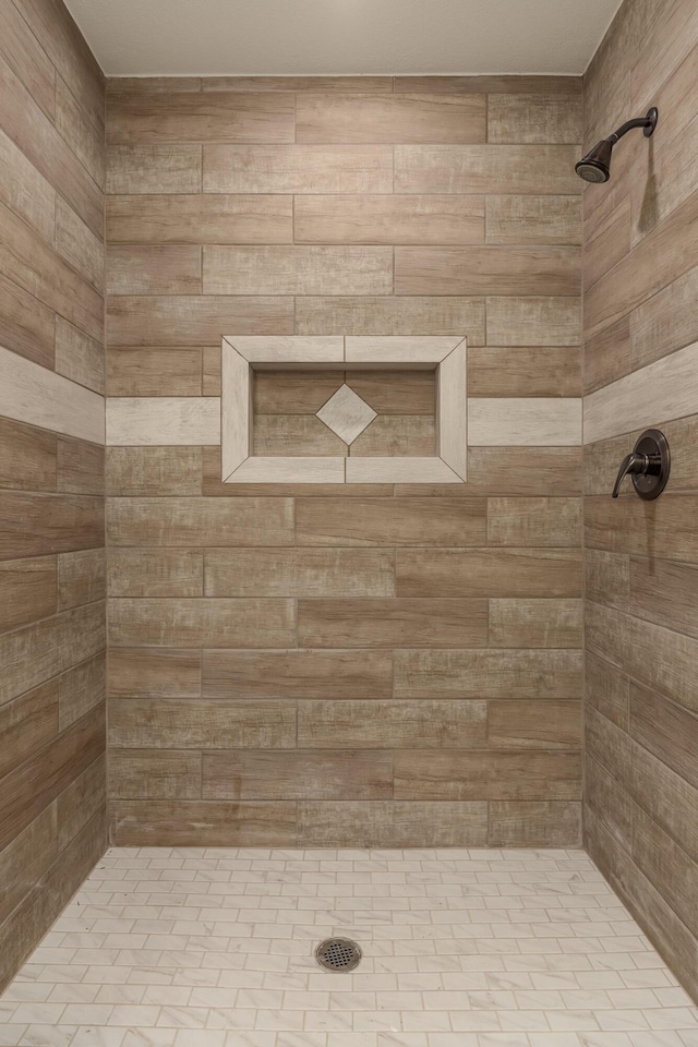 bathroom with tiled shower