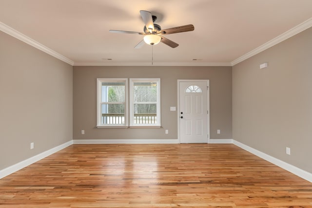 foyer with ceiling fan, crown molding, and light hardwood / wood-style flooring