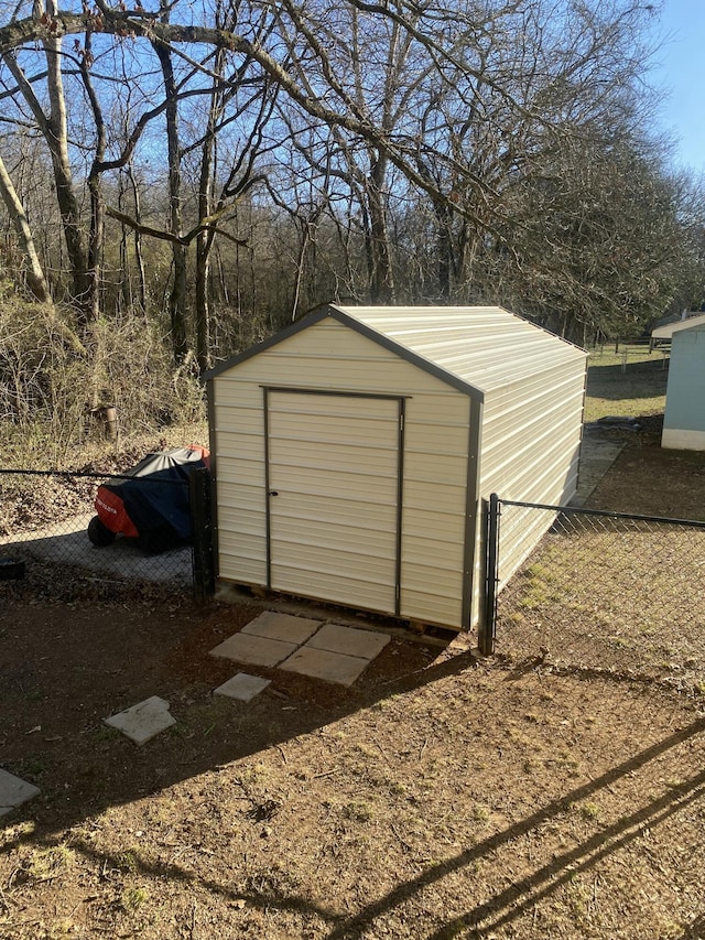 view of shed with fence