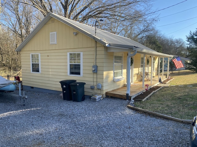 view of side of home featuring crawl space