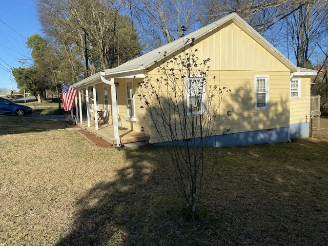 view of property exterior with crawl space and a lawn