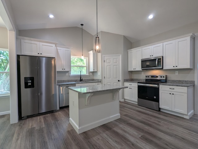 kitchen featuring a kitchen island, white cabinetry, sink, and appliances with stainless steel finishes