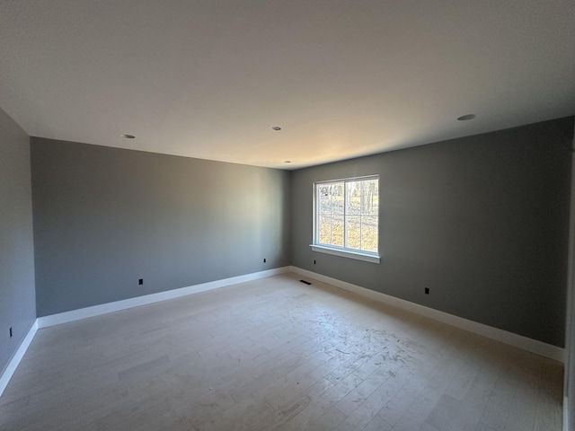 1775 Lenox Dr NW, Cleveland, TN 37312 - unfurnished room featuring baseboards, visible vents, and light wood-style flooring