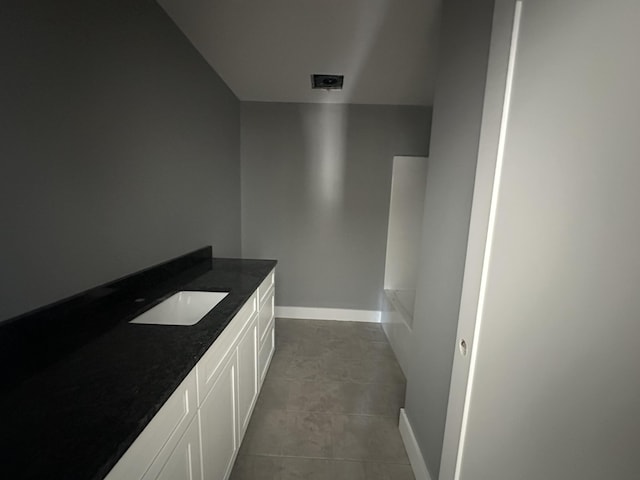 1775 Lenox Dr NW, Cleveland, TN 37312 - bathroom with tile patterned flooring, a sink, and baseboards