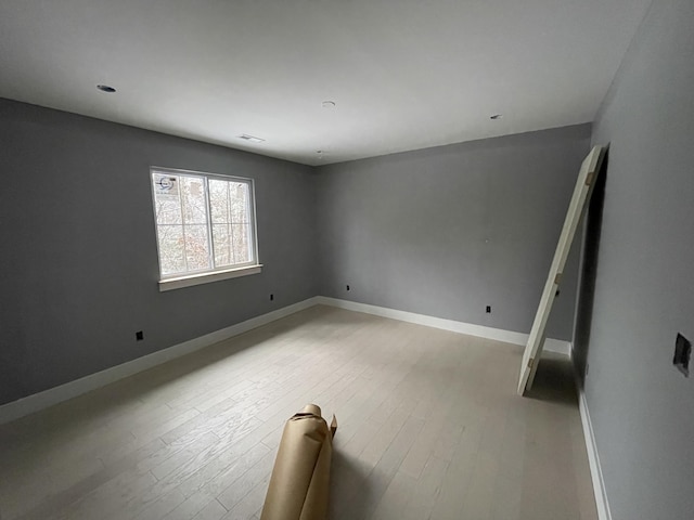 unfurnished room featuring light hardwood / wood-style floors