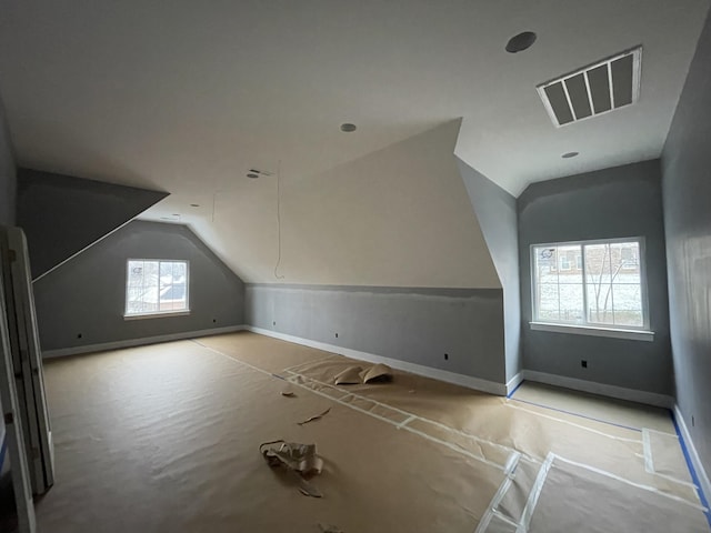 bonus room featuring vaulted ceiling