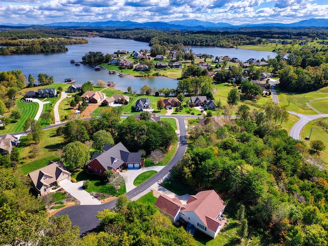 aerial view featuring a water and mountain view