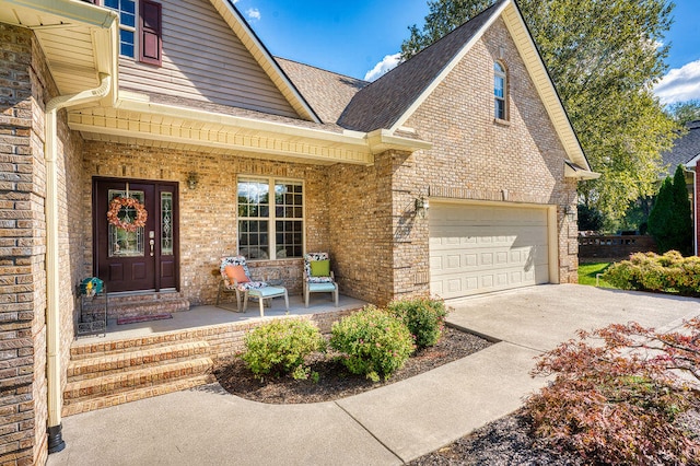 view of front of property featuring a porch and a garage