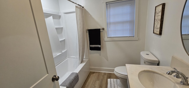 full bathroom featuring shower / bath combo, vanity, hardwood / wood-style flooring, and toilet