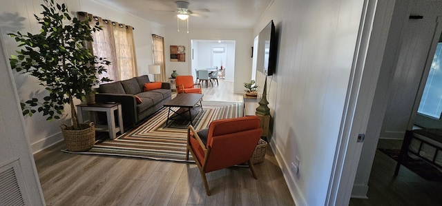 interior space with wood-type flooring and ceiling fan