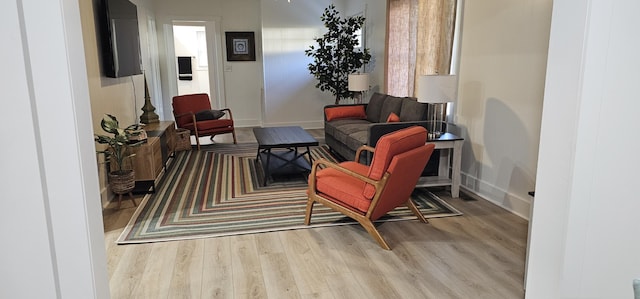 living area with light hardwood / wood-style flooring