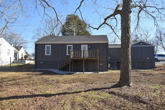 rear view of house with a wooden deck