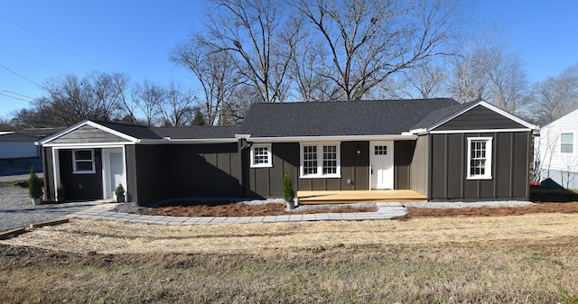 ranch-style home with a front lawn