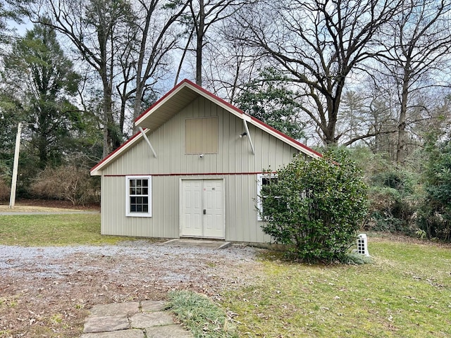 view of outdoor structure with a lawn