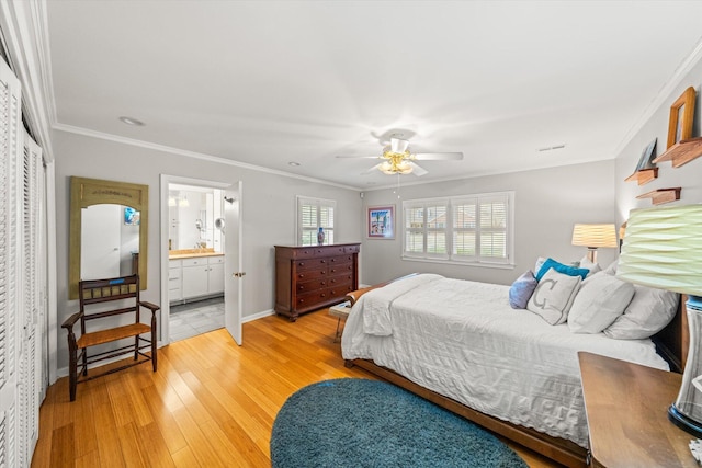 bedroom featuring crown molding, ceiling fan, wood-type flooring, and connected bathroom