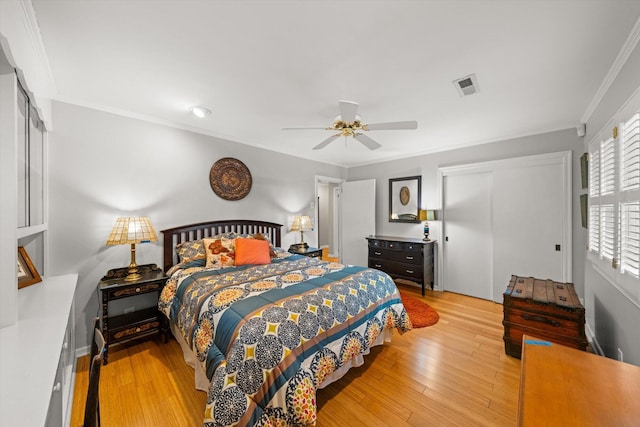 bedroom with crown molding, ceiling fan, and light wood-type flooring