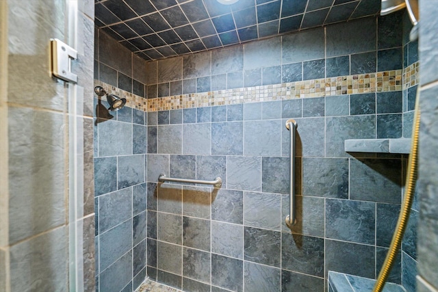 bathroom with tiled shower