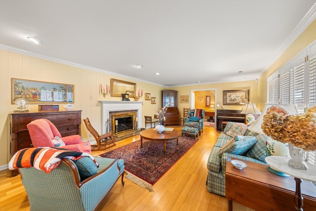 living room featuring light hardwood / wood-style flooring and ornamental molding