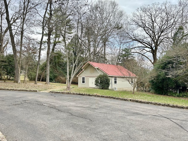 view of side of home featuring a lawn