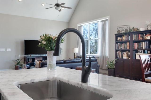 interior details featuring a ceiling fan, a sink, and recessed lighting