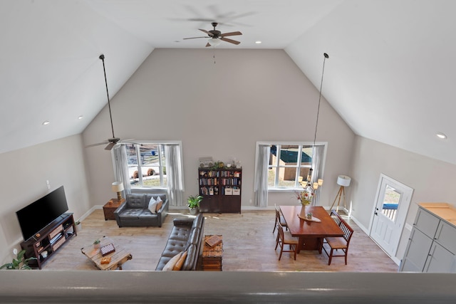 living area featuring ceiling fan, wood finished floors, and baseboards