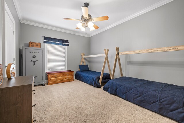 carpeted bedroom with ceiling fan and crown molding