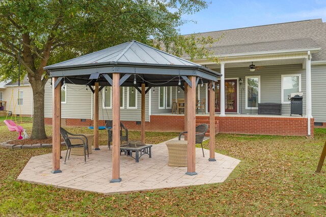 view of patio featuring a gazebo, a grill, and ceiling fan