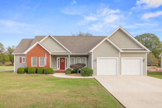 view of front of house featuring a garage and a front lawn