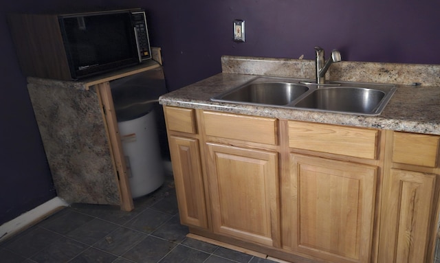 kitchen featuring light brown cabinetry and sink