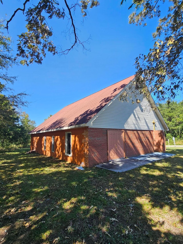 back of house with a lawn