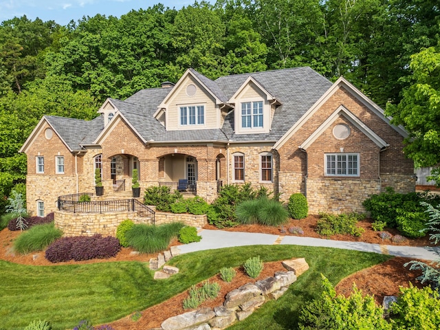 view of front of house with a front lawn and covered porch