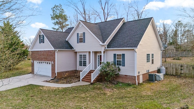 view of front of house with a garage, central AC, and a front yard