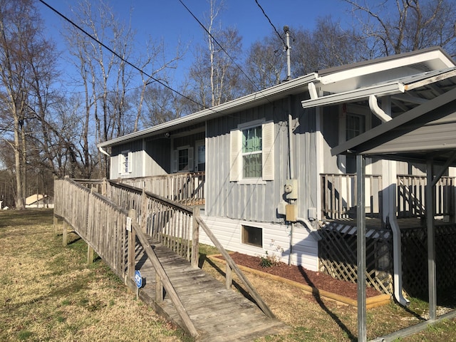 view of side of home featuring crawl space and a deck