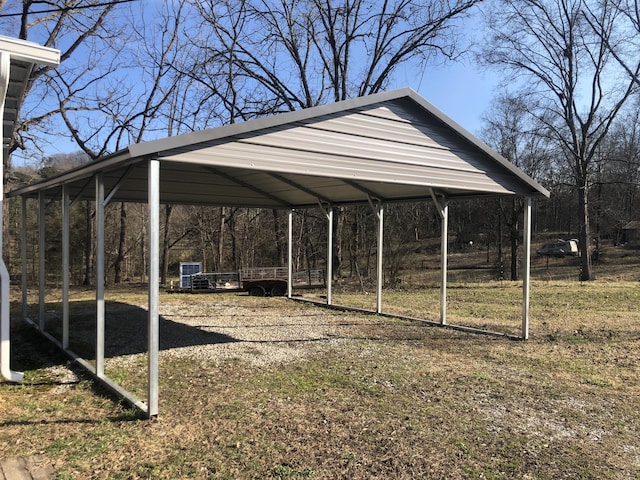 view of parking featuring driveway and a carport