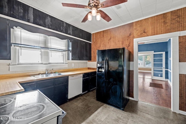 kitchen featuring sink, ceiling fan, dishwasher, electric range, and black fridge