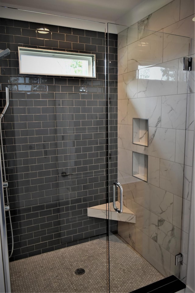 full bathroom featuring a shower stall