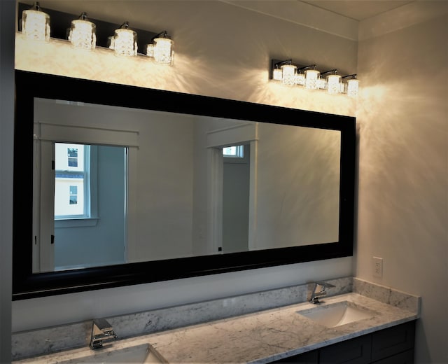 bathroom featuring vanity and a healthy amount of sunlight