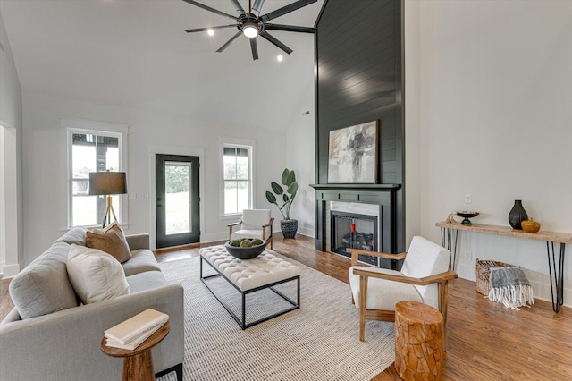 111 Arthur Ln NW, Cleveland, TN 37312 - living room with high vaulted ceiling, a fireplace, ceiling fan, wood finished floors, and baseboards