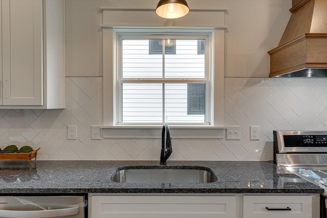 111 Arthur Ln NW, Cleveland, TN 37312 - kitchen with a sink, custom exhaust hood, stainless steel dishwasher, and white cabinets