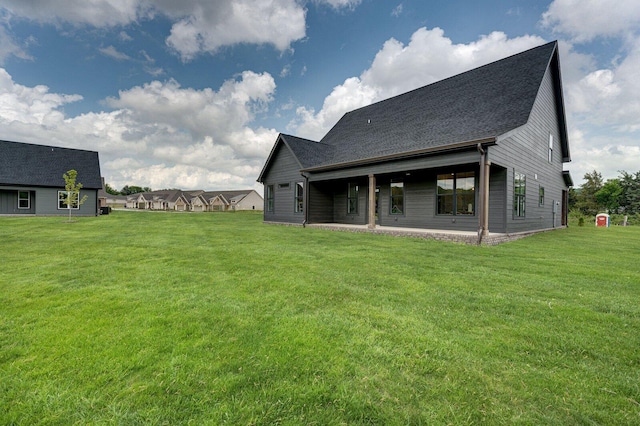 111 Arthur Ln NW, Cleveland, TN 37312 - back of house with a lawn and a shingled roof