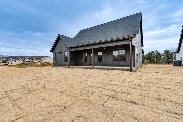 rear view of property featuring central air condition unit