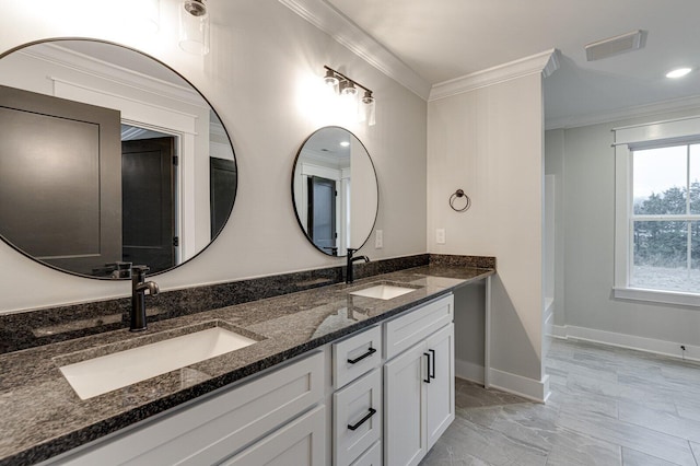 bathroom with vanity and crown molding