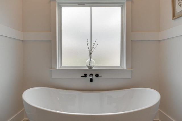 111 Arthur Ln NW, Cleveland, TN 37312 - bathroom featuring a freestanding bath and baseboards